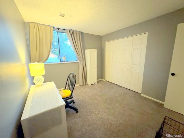 12546 E Cornell Ave Unit 104, Aurora, CO 80014 - home office with carpet floors and a textured ceiling