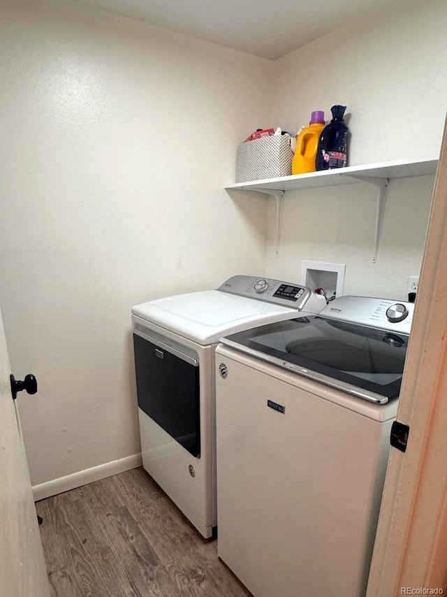 12546 E Cornell Ave Unit 104, Aurora, CO 80014 - laundry area with independent washer and dryer and light wood finished floors