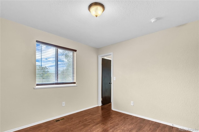 4559 Ashfield Dr, Boulder, CO 80301 - unfurnished room featuring wood finished floors, a smoke detector, and a textured ceiling