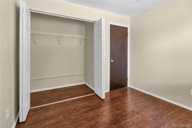 4559 Ashfield Dr, Boulder, CO 80301 - unfurnished bedroom with a closet and wood finished floors