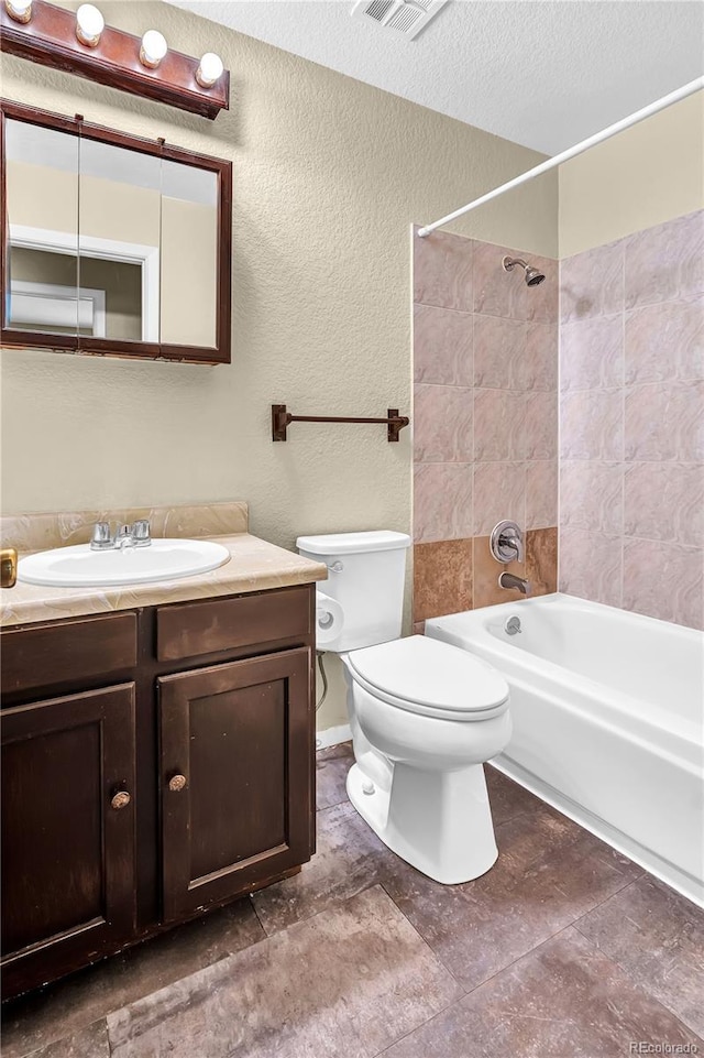 4559 Ashfield Dr, Boulder, CO 80301 - bathroom with shower / bathtub combination, vanity, a textured wall, and a textured ceiling