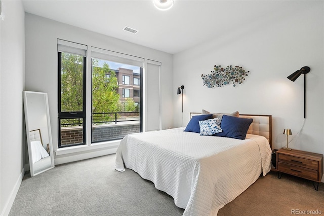 bedroom featuring carpet floors and baseboards