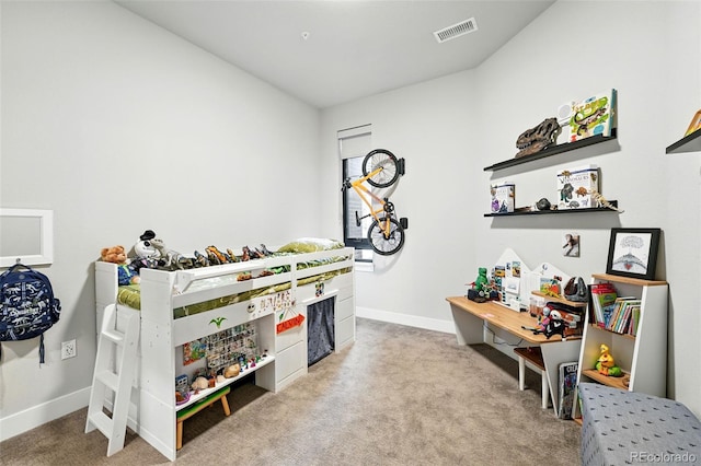 carpeted bedroom with baseboards