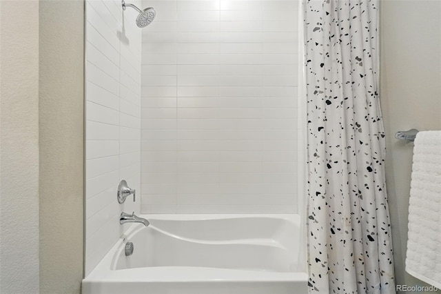 bathroom with shower / bath combo