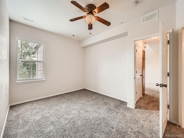 16366 E Fremont Ave Unit 11, Aurora, CO 80016 - unfurnished room featuring carpet, a ceiling fan, baseboards, and a smoke detector