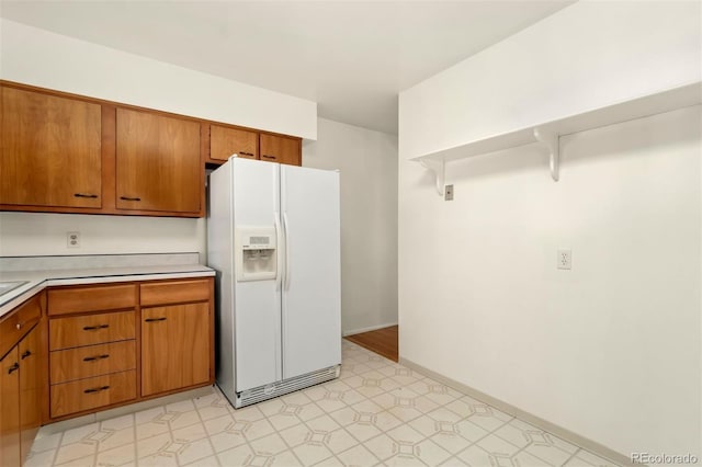 kitchen with white fridge with ice dispenser