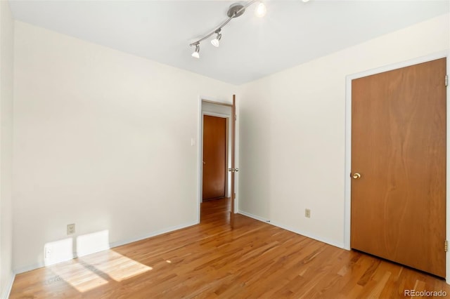 empty room featuring wood-type flooring