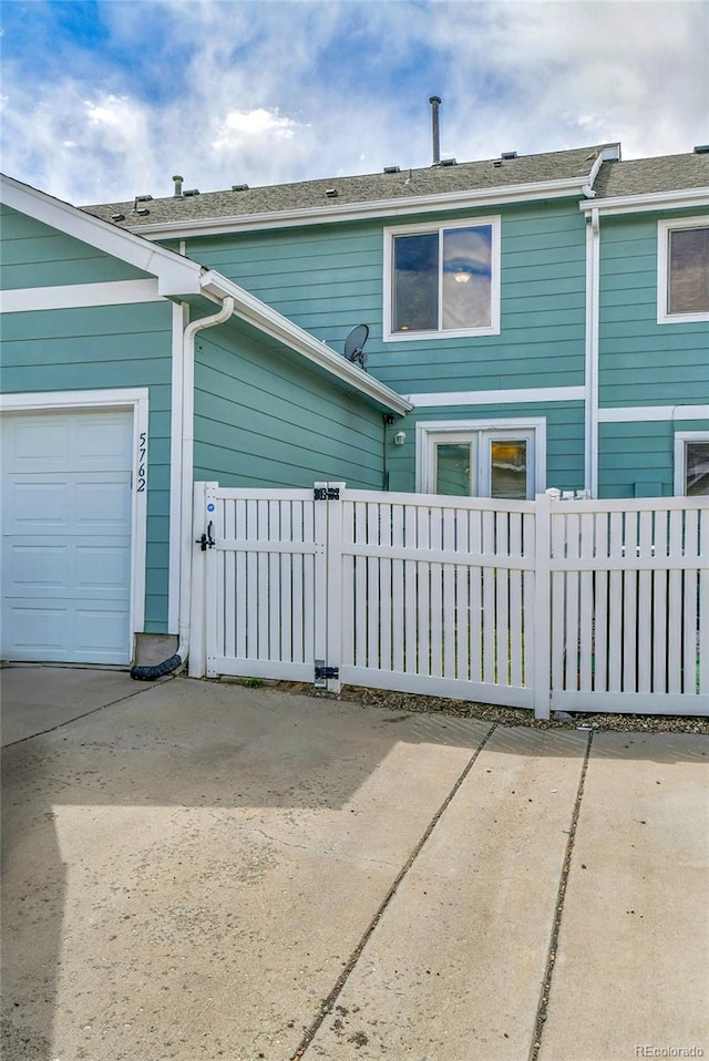 5762 Ceylon St, Denver, CO 80249 - view of front of property featuring fence and an attached garage