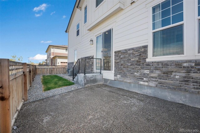 view of side of property featuring a patio