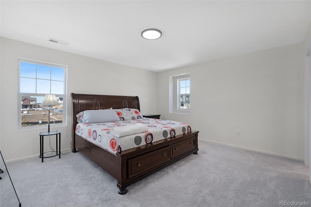 bedroom with light carpet