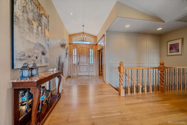 1015 Nob Hill Rd, Evergreen, CO 80439 - foyer entrance with recessed lighting, lofted ceiling, and wood finished floors