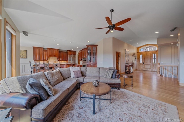1015 Nob Hill Rd, Evergreen, CO 80439 - living area featuring vaulted ceiling, recessed lighting, light wood-style floors, and a ceiling fan