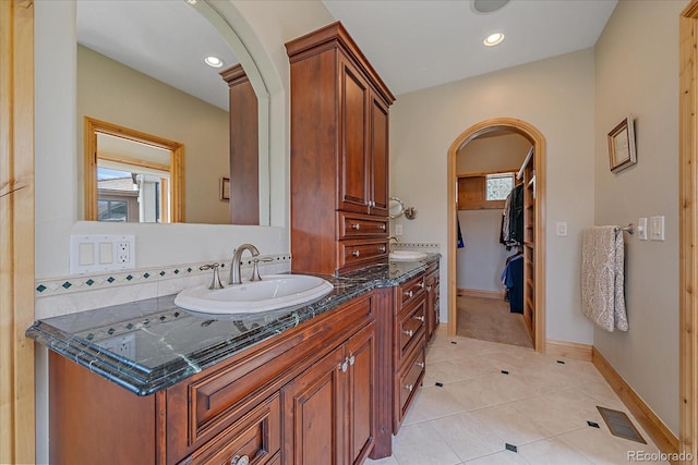 1015 Nob Hill Rd, Evergreen, CO 80439 - bathroom with a sink, double vanity, plenty of natural light, visible vents, and tile patterned flooring