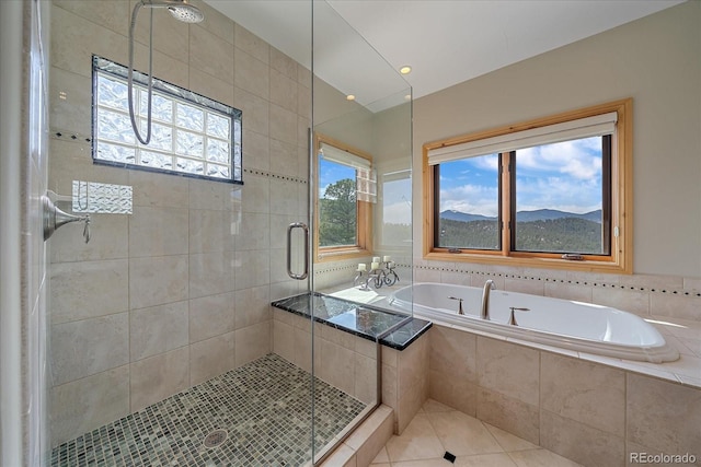 1015 Nob Hill Rd, Evergreen, CO 80439 - bathroom with a shower stall, a garden tub, and tile patterned flooring