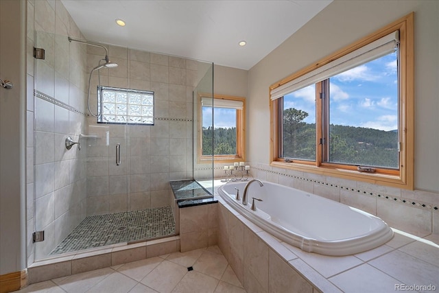 1015 Nob Hill Rd, Evergreen, CO 80439 - bathroom featuring tile patterned floors, a garden tub, recessed lighting, and a stall shower
