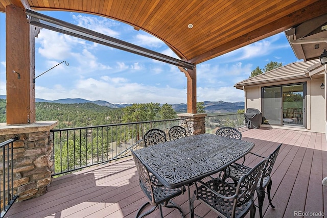 1015 Nob Hill Rd, Evergreen, CO 80439 - deck featuring outdoor dining area, area for grilling, and a mountain view