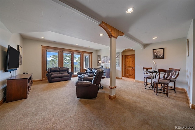1015 Nob Hill Rd, Evergreen, CO 80439 - living area featuring light carpet, baseboards, arched walkways, and recessed lighting
