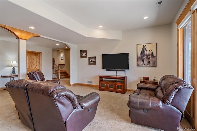 1015 Nob Hill Rd, Evergreen, CO 80439 - living area with arched walkways, baseboards, and recessed lighting