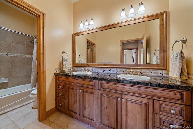 1015 Nob Hill Rd, Evergreen, CO 80439 - full bathroom with tile patterned flooring, toilet, shower / bath combo, and a sink