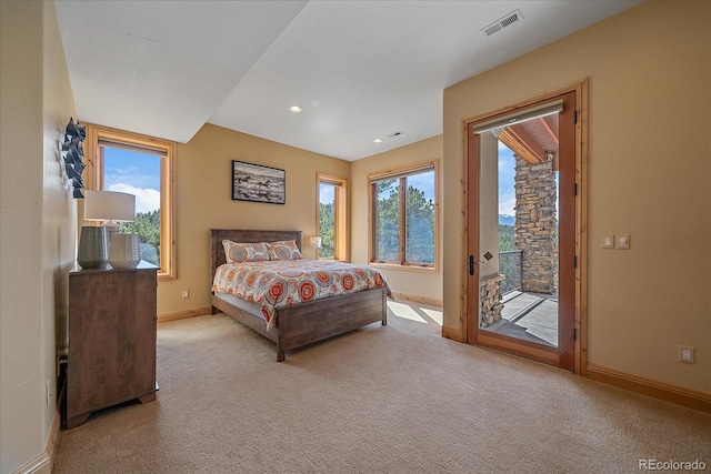 1015 Nob Hill Rd, Evergreen, CO 80439 - carpeted bedroom with access to exterior, baseboards, multiple windows, and visible vents