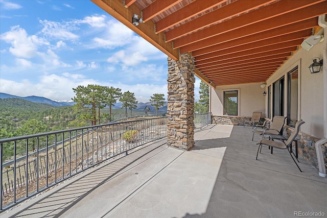 1015 Nob Hill Rd, Evergreen, CO 80439 - view of patio / terrace with a balcony and a mountain view
