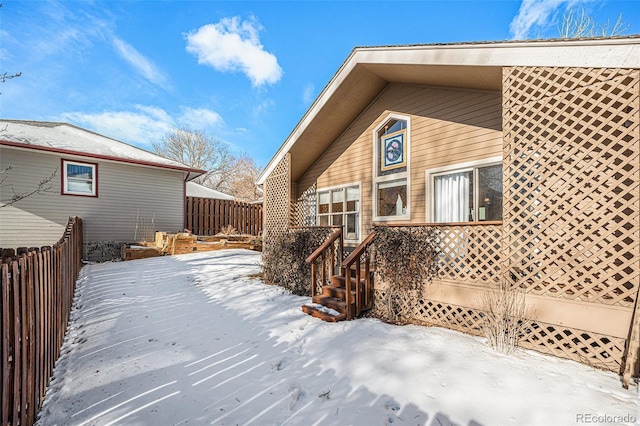 view of snow covered house