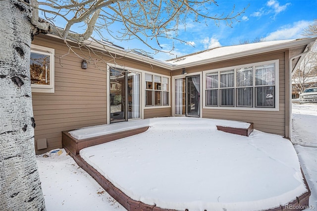 view of snow covered property