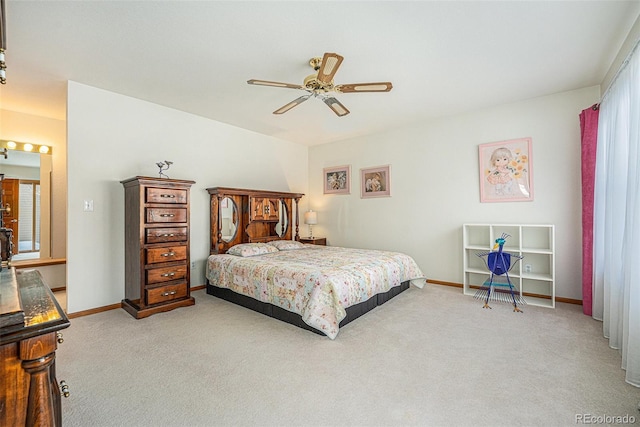 bedroom with light carpet and ceiling fan