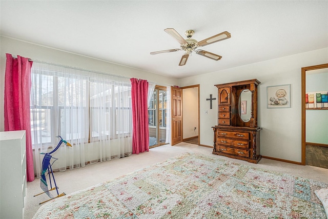 carpeted bedroom with access to exterior and ceiling fan