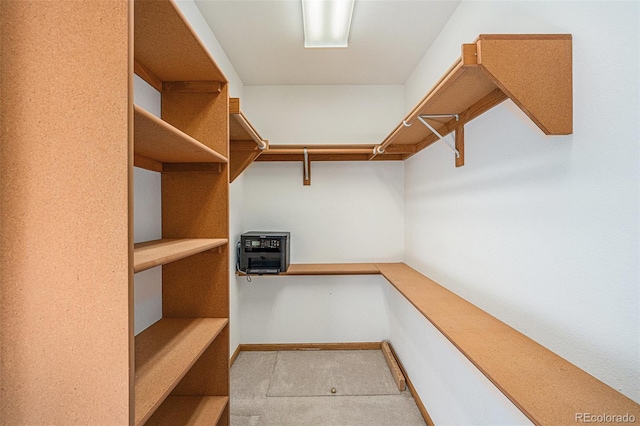 spacious closet featuring heating unit