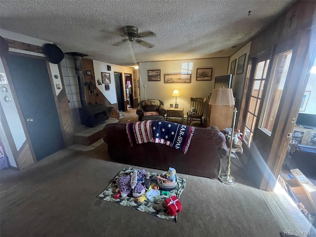 11798 Sidney Rd, Golden, CO 80403 - living area with a textured ceiling, carpet flooring, ceiling fan, and a wood stove