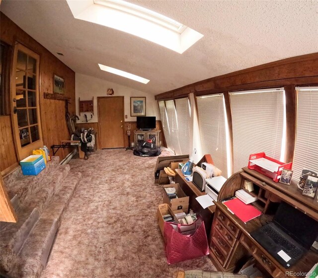 11798 Sidney Rd, Golden, CO 80403 - living room featuring lofted ceiling, carpet floors, a skylight, a textured ceiling, and wooden walls