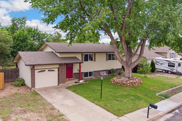 4035 Cantrell Dr, Colorado Springs, CO 80911 - tri-level home with an attached garage, a shingled roof, driveway, and brick siding