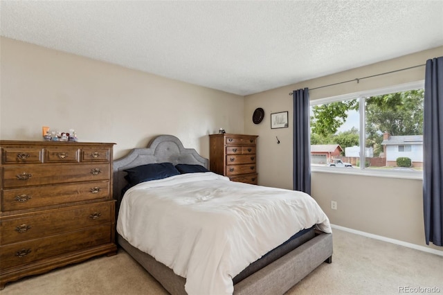 4035 Cantrell Dr, Colorado Springs, CO 80911 - bedroom featuring light colored carpet and a textured ceiling
