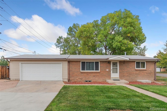 single story home with a front yard and a garage