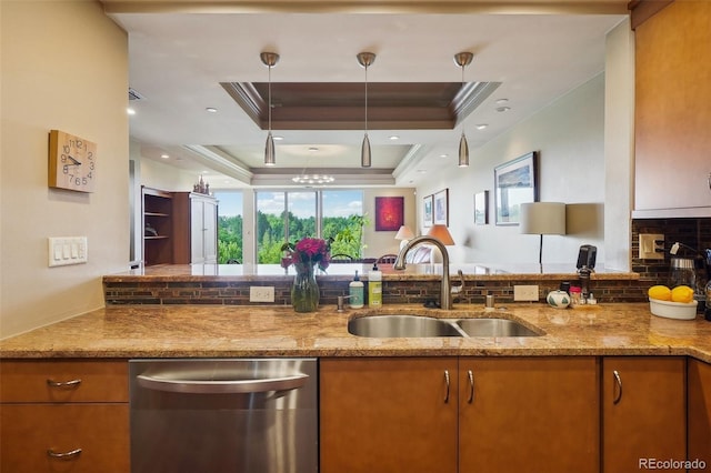 kitchen with a raised ceiling, light stone countertops, sink, and dishwasher