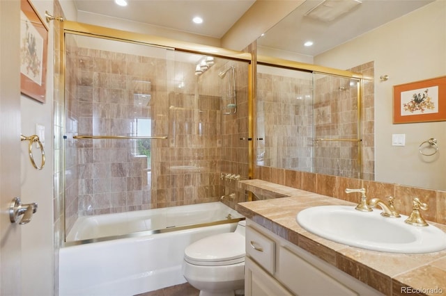 full bathroom with toilet, bath / shower combo with glass door, backsplash, and vanity