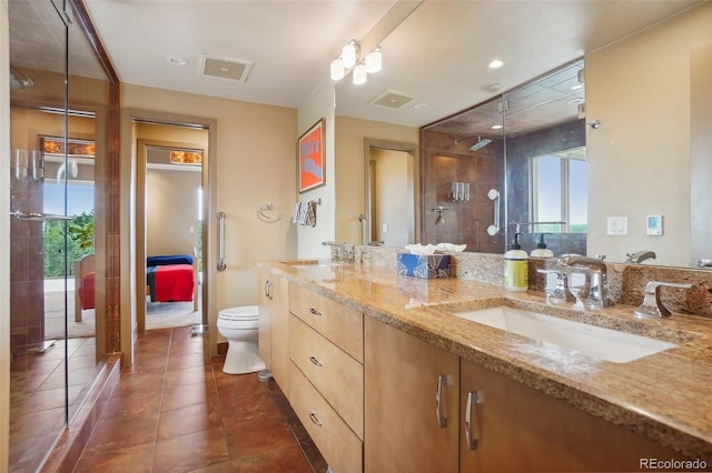 bathroom with visible vents, a stall shower, toilet, and a sink