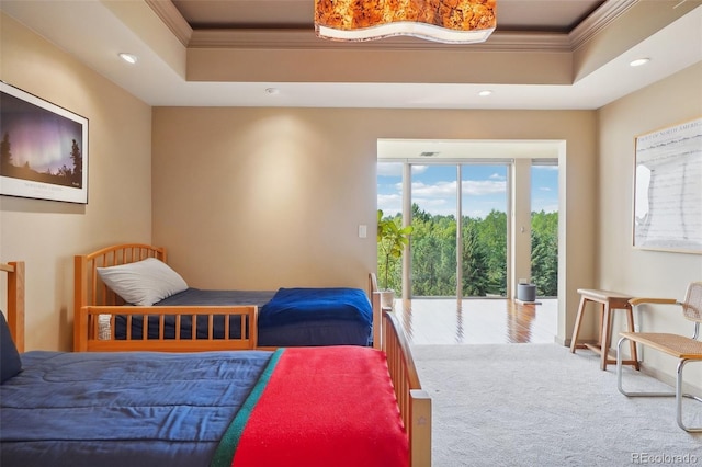 carpeted bedroom with access to exterior, recessed lighting, crown molding, and a raised ceiling