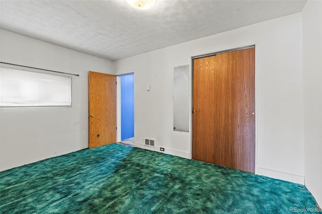 116 E 12th St, Leadville, CO 80461 - unfurnished bedroom with a textured ceiling, visible vents, and carpet floors
