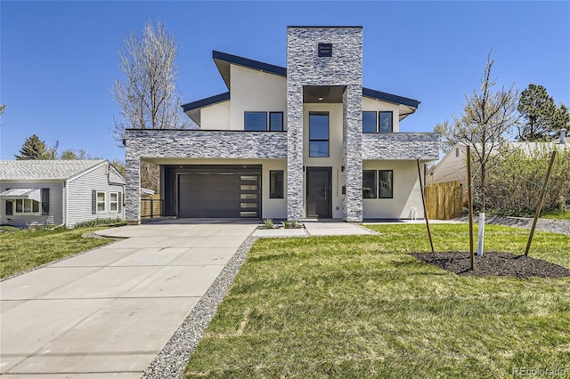 contemporary house with a garage and a front lawn