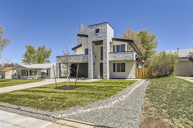 contemporary house with a garage and a front lawn