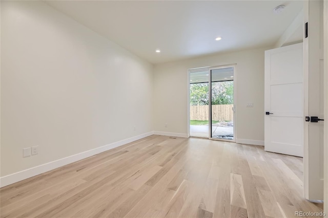 unfurnished room featuring light hardwood / wood-style flooring