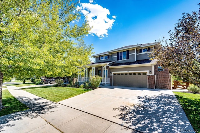 view of front of house featuring a garage and a front lawn