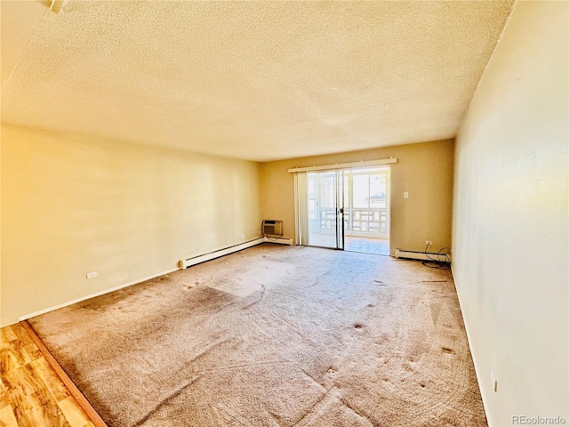 carpeted empty room with a textured ceiling and a baseboard radiator