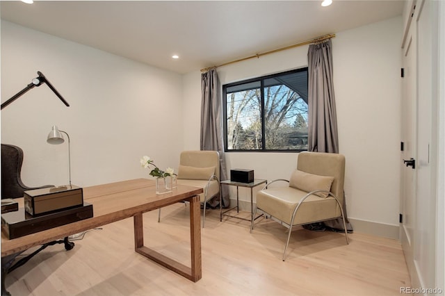 office space with light hardwood / wood-style flooring