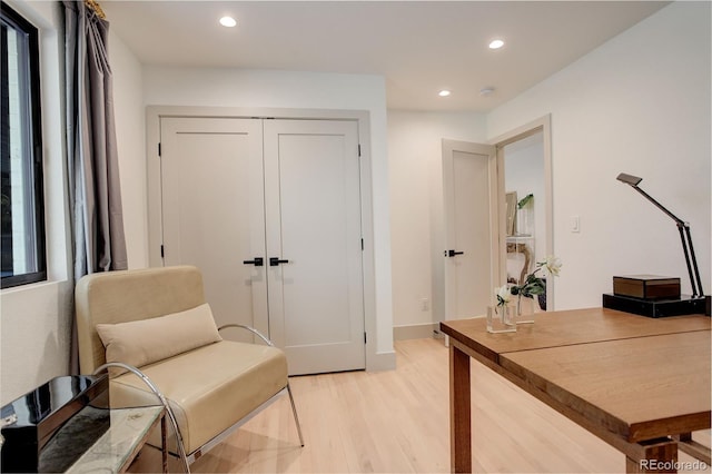 office space with light wood-type flooring