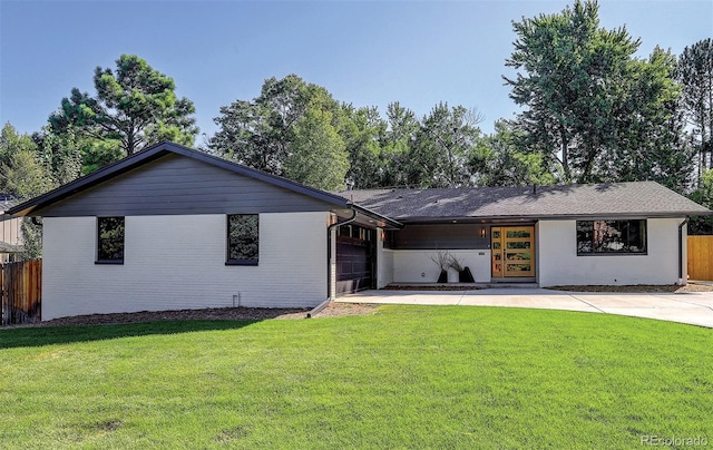 single story home with a garage and a front yard