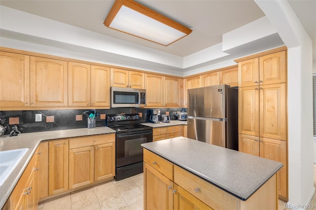 kitchen featuring stainless steel appliances, light brown cabinetry, a kitchen island, and backsplash