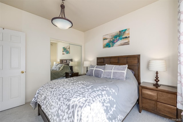 carpeted bedroom featuring a closet